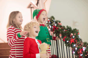 12 Festive Ways to Keep Kids’ Smiles Healthy This Holiday, Kids smiling at christmas